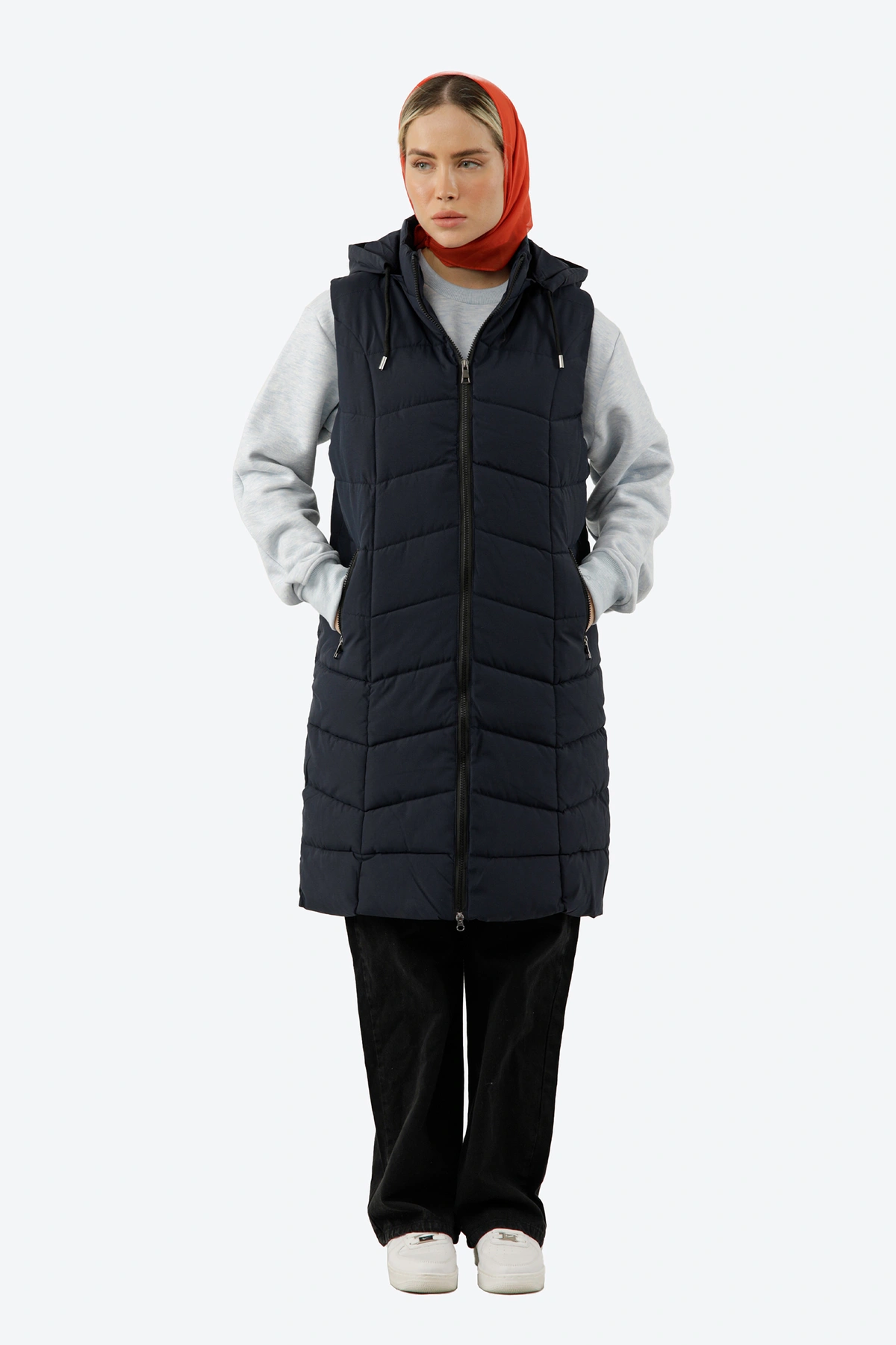 پافر شمعی زنانه رنگ سرمه ای ، پافر بلند کلاهدار جداشونده توسط زیپ. 