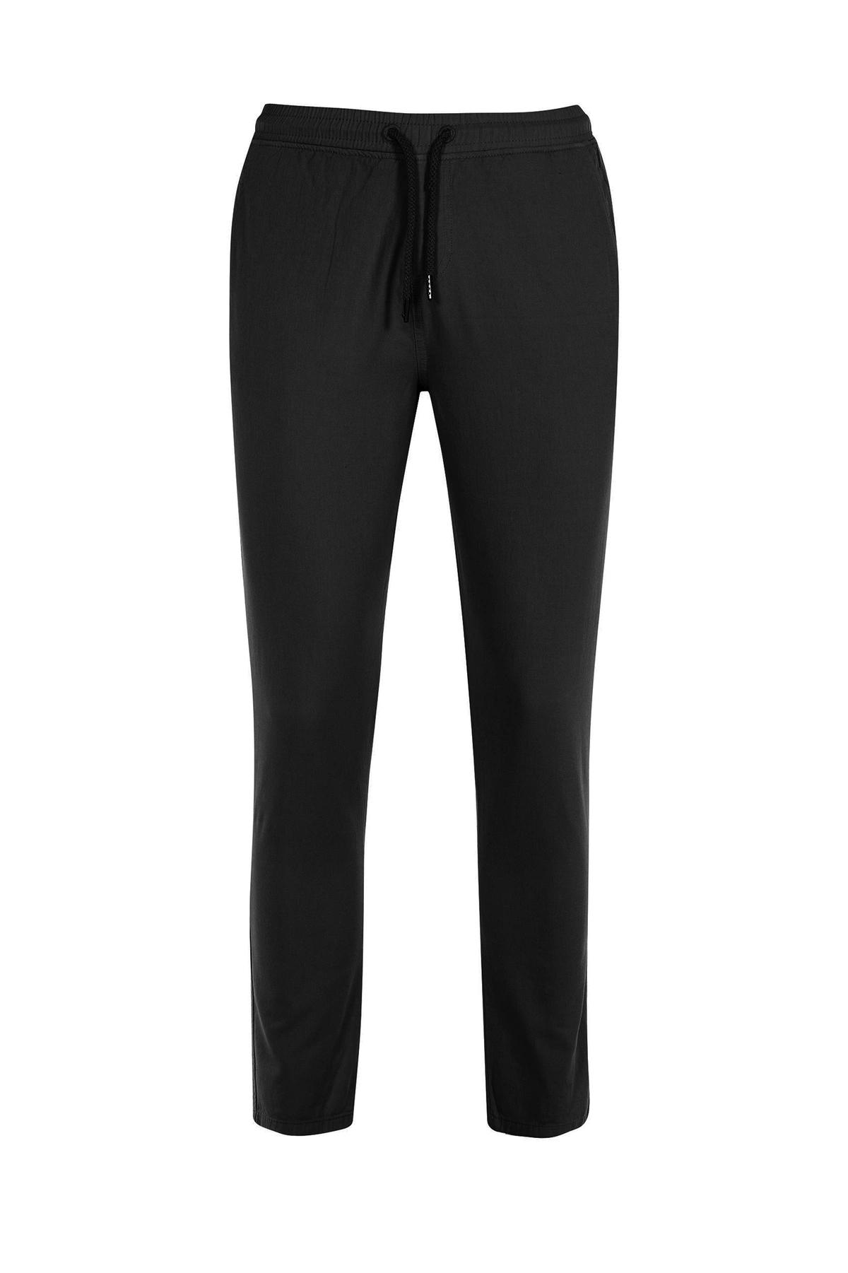 شلوار جین کمرکشدار رنگ مشکی از برند پاتن جامه. 