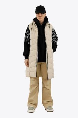 پافر شمعی زنانه رنگ رنگ کرم ، پافر بلند کلاهدار جداشونده توسط زیپ. 